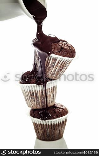 muffins with chocolate sauce over white