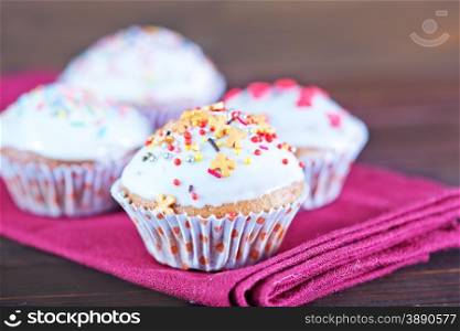 muffins with color candy on the plate