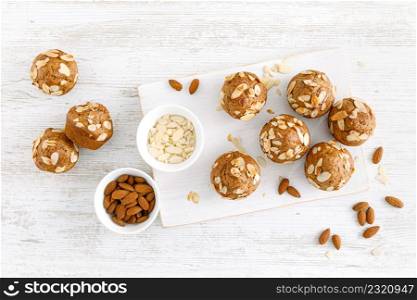 Muffins with flaked almond nuts. Cupcakes with nut chips. Top view