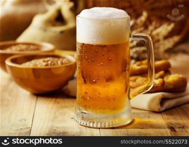 mug of beer on wooden table