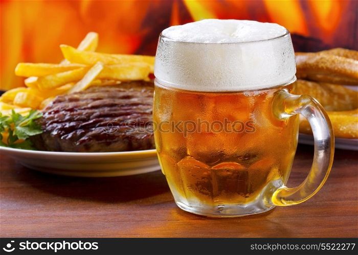 mug of beer with grilled meat