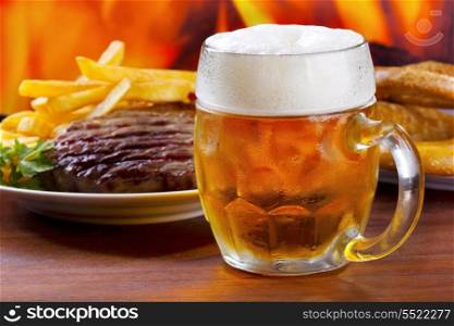 mug of beer with grilled meat