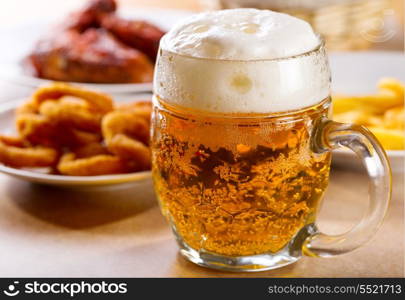 mug of beer with various snack