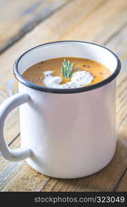 Mug of pumpkin cream soup