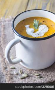 Mug of pumpkin cream soup