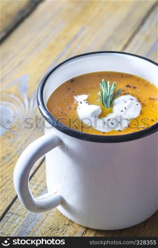 Mug of pumpkin cream soup