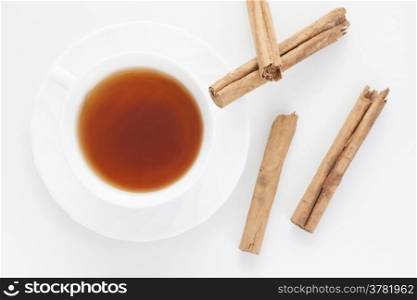 Mug of Red tea with cinnamon. Stock