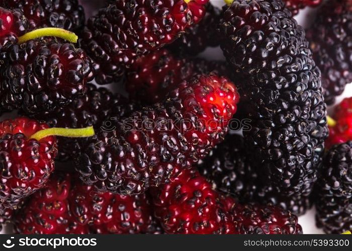 Mulberry berries close up as a background