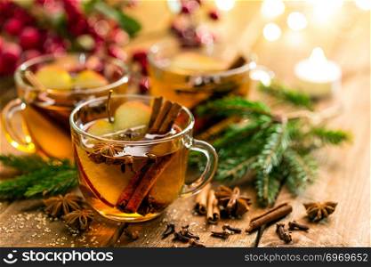 Mulled cider with cinnamon, cloves and anise. Traditional Christmas drink