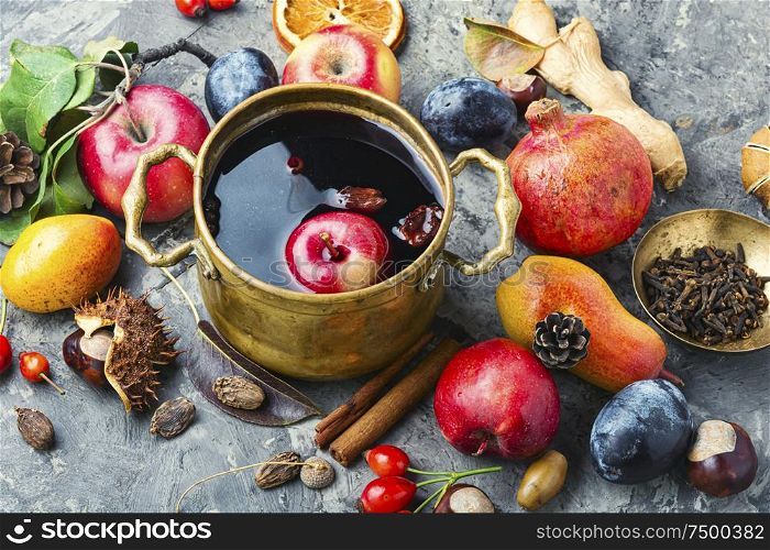 Mulled wine in a stylish bowl.Warm autumn alcoholic drink. Autumn mulled wine