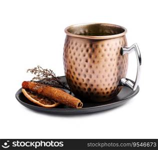 Mulled wine in vintage metal mug with cinnamon