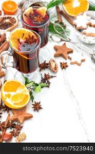 Mulled wine ingredients on bright background. Hot red punch with fruit and spices. Christmas food and drinks