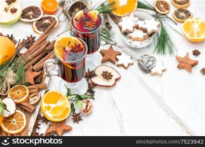 Mulled wine ingredients on bright background. Hot red punch with fruit and spices. Christmas food and drinks