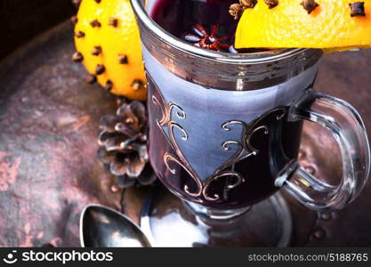 Mulled wine with orange. Christmas mulled wine with orange slice in stylish glass