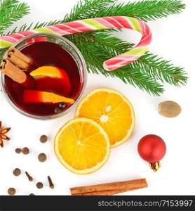 Mulled wine with orange, cinnamon sticks, anise isolated on white background. Flat lay, top view.