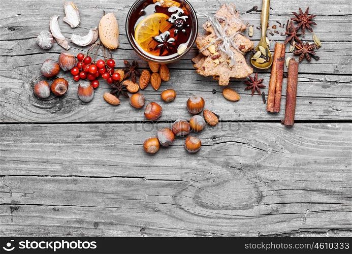 Mulled wine with spices. glass of mulled wine and spice rack for beverage