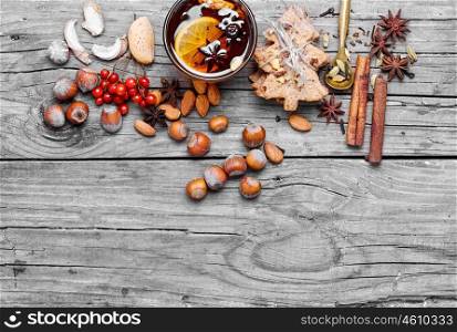 Mulled wine with spices. glass of mulled wine and spice rack for beverage
