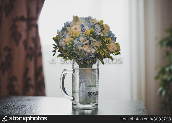 Multi-color bunch of flowers in a vase on a table.. Bunch of flowers in a vase 2905.. Bunch of flowers in a vase 2905.
