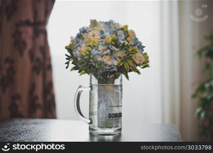 Multi-color bunch of flowers in a vase on a table.. Bunch of flowers in a vase 2905.. Bunch of flowers in a vase 2905.