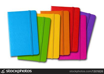 Multi color closed notebooks range isolated on white. Multi color closed notebooks range