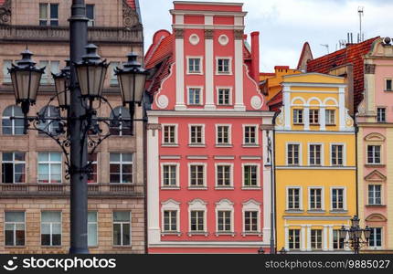 Multi-colored facades of medieval houses on the town hall square. Wroclaw. Poland.. Wroclaw. Old colorful houses in the historical part of the city.