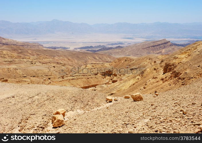 Multi-colored mountains in the south of Israel, the descent to the Gulf of Eilat Red Sea