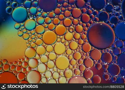 multi colored oil circles on the water, colorful abstract background