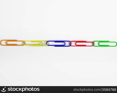 Multi colored paper clips in row