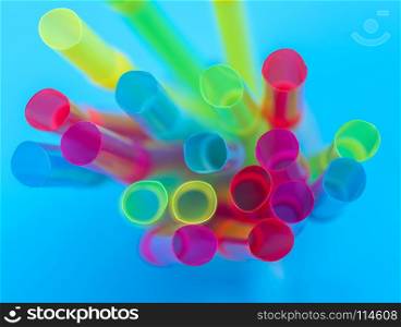 multi-colored plastic tubes for a cocktail, top view, close up