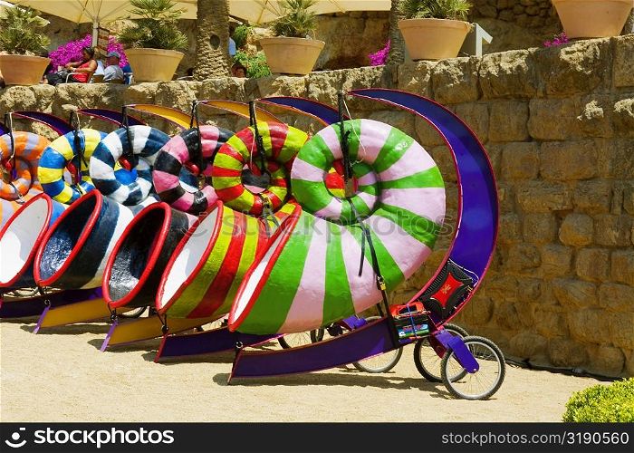 Multi-colored sculptures in a garden, Parc Guell, Barcelona, Spain
