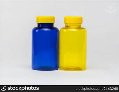 Multi colored transparent plastic pill jars on a white background. Isolated. plastic pill jars