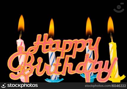 "Multi coloured candles with "Birthday" isolated on black"