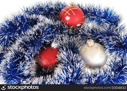 Multi-coloured Christmas-tree decorations lay on a garland