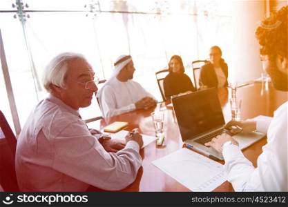multi ethnic business people group on meeting at modern office