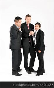 Multi-ethnic business people standing together and looking at a mobile phone