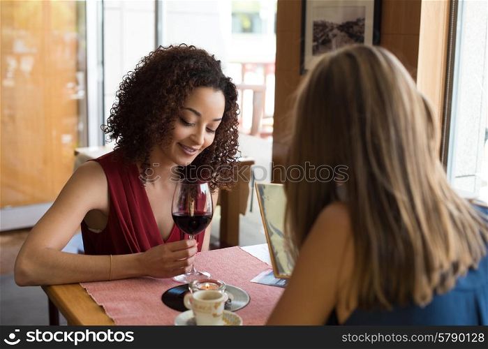 Multi ethnic friends taking and drinking in bar