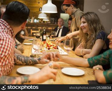 Multi-ethnic group of friends dinner at the restaurant