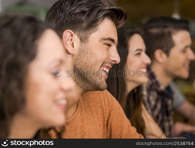 Multi-Ethnic Group of happy friends having fun at the restaurant