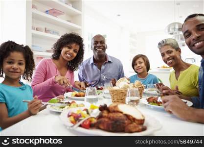 Multi Generation African American Family Eating Meal At Home