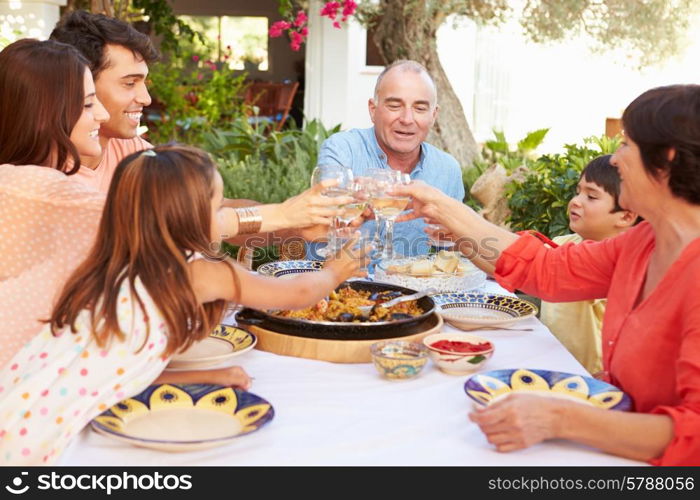 Multi Generation Family Making Toast Before Meal Together