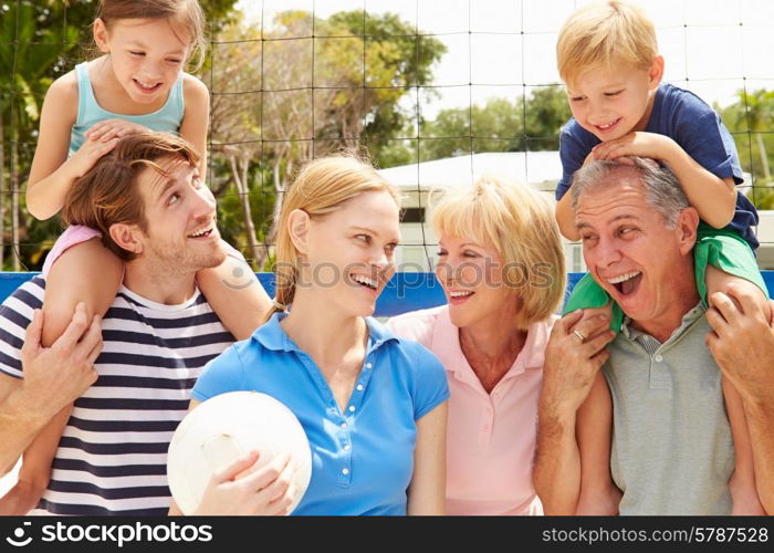 Multi Generation Family Playing Volleyball Together