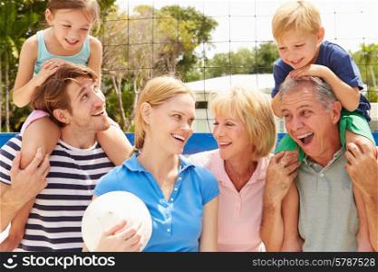 Multi Generation Family Playing Volleyball Together