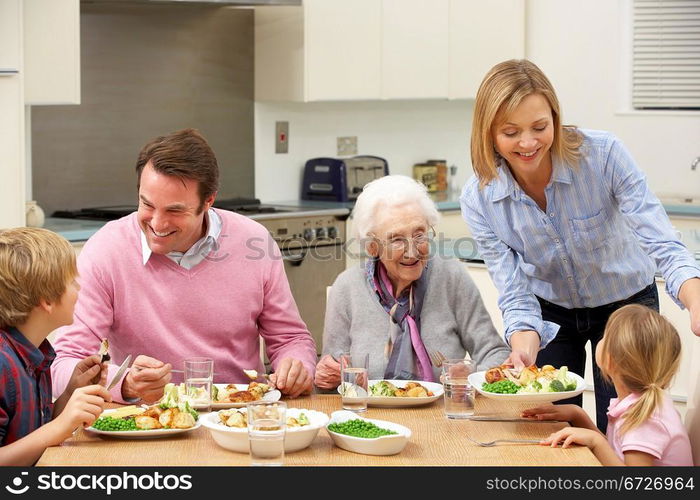 Multi-generation family sharing meal together