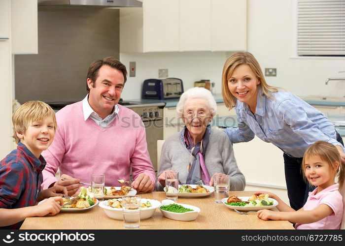 Multi-generation family sharing meal together