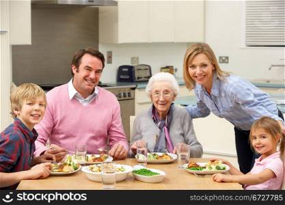 Multi-generation family sharing meal together