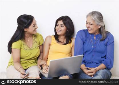Multi generational family talking while shopping online