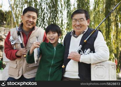 Multi-generational men fishing portrait