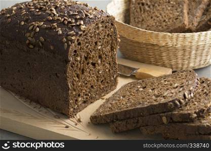 Multi grain bread and slices on a cutting board close up