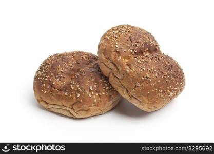 Multi grain bread rolls on white background