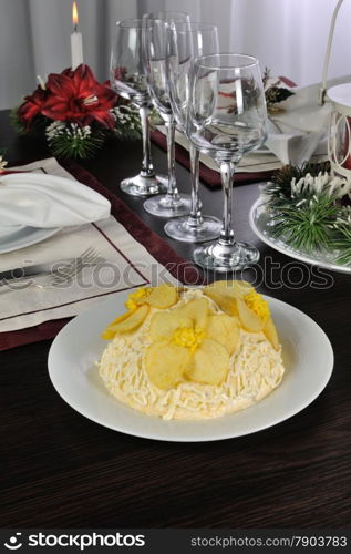 Multi-layer salad with mayonnaise with the flowers of chips